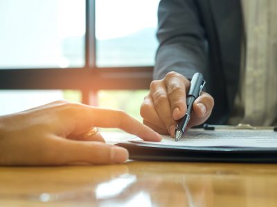Business concept, signing a business contract,Businessmen holding pens are signing a contract.