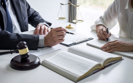 Consultation and conference of professional businesswoman and Male lawyers working and discussion having at law firm in office. Concepts of law, Judge gavel with scales of justice.